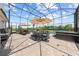 This screened pool area boasts ample space for dining and lounging, complete with a hot tub and seating at 4551 Hunting Lodge Dr, St Cloud, FL 34772