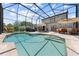 A backyard oasis with a large screened pool, patio, and seating, perfect for outdoor entertaining at 4551 Hunting Lodge Dr, St Cloud, FL 34772