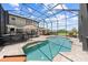 A backyard oasis with a large screened pool, patio, and seating, perfect for outdoor entertaining at 4551 Hunting Lodge Dr, St Cloud, FL 34772