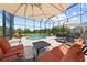 Enjoy the spacious screened pool area complete with lounge chairs, umbrellas, and ample seating at 4551 Hunting Lodge Dr, St Cloud, FL 34772