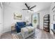 Cozy sitting room with comfortable seating, stylish decor and an abundance of natural light at 4551 Hunting Lodge Dr, St Cloud, FL 34772