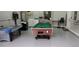 Brightly lit game room with an air hockey table, pool table, washer/dryer, and a Golden Tee arcade console at 477 Orange Cosmos Blvd, Davenport, FL 33837