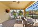 Covered outdoor patio featuring neutral furniture, a ceiling fan, and an exterior view at 477 Orange Cosmos Blvd, Davenport, FL 33837