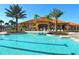 This expansive pool area offers ample space for swimming and relaxation, complete with lush landscaping at 477 Orange Cosmos Blvd, Davenport, FL 33837
