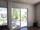Backyard view through sliding glass doors providing a seamless transition to outdoor space at 5019 Pineapple St, Lake Wales, FL 33898