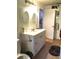 Bathroom featuring dual sinks and wooden flooring at 5019 Pineapple St, Lake Wales, FL 33898