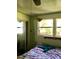 Bedroom featuring two windows for natural light and ceiling fan at 5019 Pineapple St, Lake Wales, FL 33898