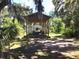 Exterior view with driveway to covered parking at 5019 Pineapple St, Lake Wales, FL 33898