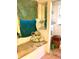 Laundry room featuring a cushioned bench, shelving, and washer at 5019 Pineapple St, Lake Wales, FL 33898