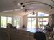 Bright living room with large windows allowing ample natural light and views of the surrounding greenery at 5019 Pineapple St, Lake Wales, FL 33898