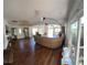 View of living room with hardwood floors and large windows offering natural light and outdoor views at 5019 Pineapple St, Lake Wales, FL 33898