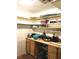 Butler's pantry features built in wooden shelves and cabinetry at 5019 Pineapple St, Lake Wales, FL 33898