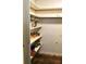 Walk-in pantry features built in wooden shelves and an open design at 5019 Pineapple St, Lake Wales, FL 33898