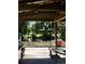 Inviting covered patio offers a relaxing waterfront view with outdoor seating and a grill at 5019 Pineapple St, Lake Wales, FL 33898