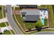 Aerial view of a home featuring a patio, pool, green backyard, and grey roof at 5100 Violet Ln, Kissimmee, FL 34758