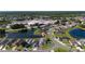 Aerial view of the home, construction, lake, and surrounding neighborhood at 5100 Violet Ln, Kissimmee, FL 34758
