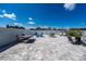 Wide backyard featuring multiple outdoor dining spaces and a large paved patio at 5100 Violet Ln, Kissimmee, FL 34758
