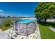Backyard featuring an above ground pool with a safety ladder and a grassy area with a shady tree at 5100 Violet Ln, Kissimmee, FL 34758