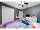 Bedroom with closet storage, vanity, and connecting door to bathroom at 5100 Violet Ln, Kissimmee, FL 34758