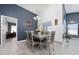 Bright dining room featuring tile floors, modern lighting, and stylish furnishings at 5100 Violet Ln, Kissimmee, FL 34758