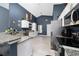 Open kitchen with granite countertops, stainless steel appliances, and plenty of cabinet space at 5100 Violet Ln, Kissimmee, FL 34758