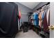 Large walk-in closet features hanging storage, shelving, and tile floors at 5100 Violet Ln, Kissimmee, FL 34758