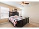 Bedroom features a ceiling fan, carpeted floors, and natural lighting at 5231 Wildwood Way, Davenport, FL 33837