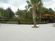 Beautifully landscaped community area with seating and a view of the lazy river at 5231 Wildwood Way, Davenport, FL 33837