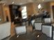Blurry shot of dining room with table and chairs at 5231 Wildwood Way, Davenport, FL 33837