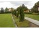Lush green space featuring manicured landscaping and a pathway, ideal for leisurely strolls and outdoor enjoyment at 5231 Wildwood Way, Davenport, FL 33837