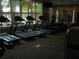 Well-lit gym with treadmills, and elliptical machines for cardio and fitness training at 5231 Wildwood Way, Davenport, FL 33837