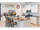 Bright kitchen featuring white cabinets, granite countertops, and stainless steel appliances at 5231 Wildwood Way, Davenport, FL 33837