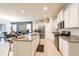 Modern kitchen with a large island, granite countertops, and stainless steel appliances, open concept at 5231 Wildwood Way, Davenport, FL 33837