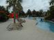 Community lazy river with a splash area. Lounge chairs nearby at 5231 Wildwood Way, Davenport, FL 33837