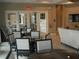 Relaxing lounge area featuring comfortable seating, tables and chairs, and bright lighting for social gatherings at 5231 Wildwood Way, Davenport, FL 33837