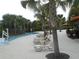 Inviting pool area with lounge chairs and palm trees for a relaxing experience at 5231 Wildwood Way, Davenport, FL 33837