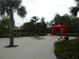 Relaxing poolside cabana with comfortable seating area, perfect for lounging at 5231 Wildwood Way, Davenport, FL 33837