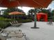Community poolside cabana with comfortable seating and lounge chairs at 5231 Wildwood Way, Davenport, FL 33837