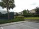Community tennis courts and lush landscaping, enhancing the property's appeal and recreational amenities at 5231 Wildwood Way, Davenport, FL 33837