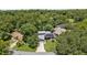 Beautiful home nestled in a serene wooded setting with lush trees and solar panels, offering a private oasis at 878 Elgin Dr, Winter Springs, FL 32708