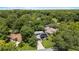 Charming home surrounded by lush greenery, with solar panels on roof in a serene and private setting at 878 Elgin Dr, Winter Springs, FL 32708