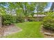 Spacious backyard featuring a well-maintained lawn and partial fence at 878 Elgin Dr, Winter Springs, FL 32708