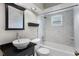 Bathroom featuring modern marble tiling and white sink, toilet, and tub at 878 Elgin Dr, Winter Springs, FL 32708