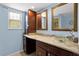 Charming bathroom with glass sink bowl, granite countertops, and cherry wood cabinetry at 878 Elgin Dr, Winter Springs, FL 32708