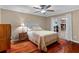 Bedroom features a queen-sized bed, natural light, and a bedside table with a lamp at 878 Elgin Dr, Winter Springs, FL 32708