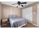 Bedroom with bed, ceiling fan, and closet; carpeted with minimal decor, cozy and functional at 878 Elgin Dr, Winter Springs, FL 32708