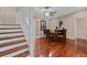 Elegant dining room featuring hardwood floors, a ceiling fan, and seating for four at 878 Elgin Dr, Winter Springs, FL 32708