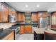 Modern kitchen offering stainless steel appliances, dark countertops, and plenty of cabinetry at 878 Elgin Dr, Winter Springs, FL 32708