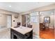 Open kitchen area with stainless steel appliances, a functional island, and access to the dining room at 878 Elgin Dr, Winter Springs, FL 32708