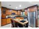 Well-equipped kitchen featuring stainless steel appliances, granite countertops, and ample cabinet space at 878 Elgin Dr, Winter Springs, FL 32708